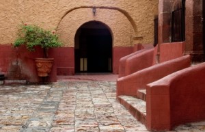 An adobe court yard in a colonial building in San Miguel de Allende, Mexico
