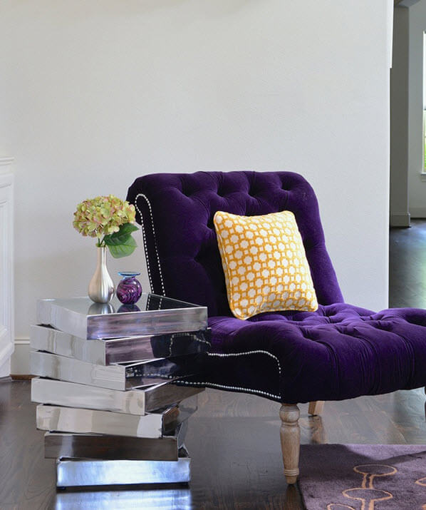 purple chair wood floor area rug vase flowers sidetable